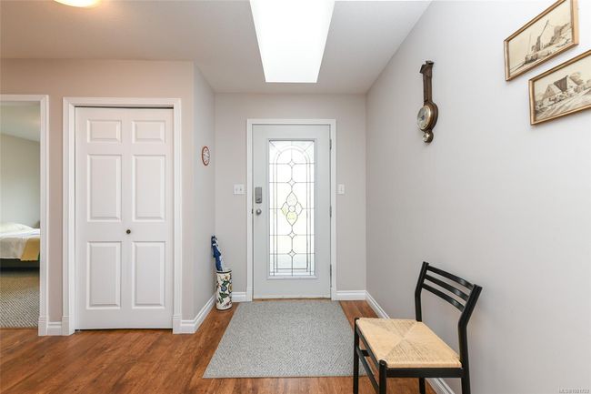 Entryway featuring wood finished floors and baseboards | Image 17