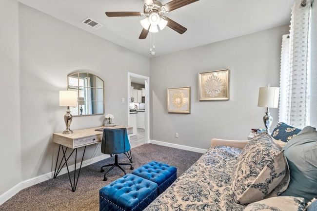 Office area with carpet floors and ceiling fan | Image 21