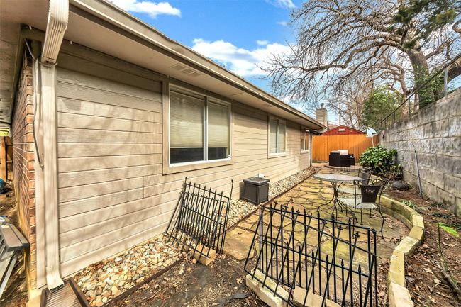 View of property exterior with a fenced backyard, a patio, and central AC | Image 31