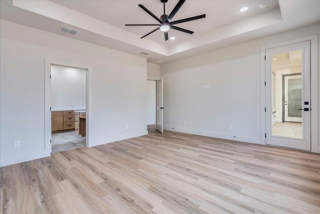 Primary bedroom showing access to the patio | Image 16