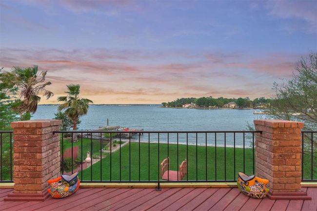 The view from the second-floor balcony is truly breathtaking, offering a stunning vantage point over the lake. | Image 14