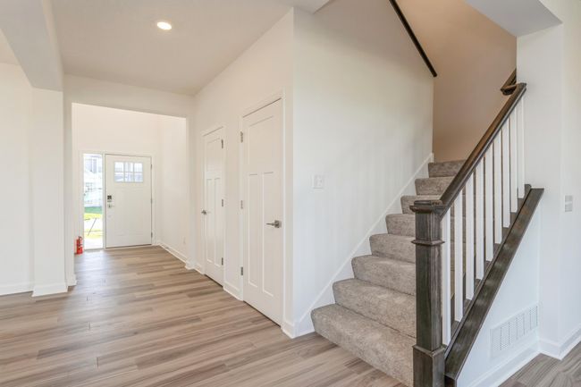 Photo is of the actual home. The stairs lead to the upper level. | Image 11