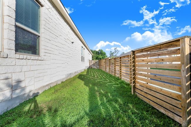 View of fenced backyard | Image 32