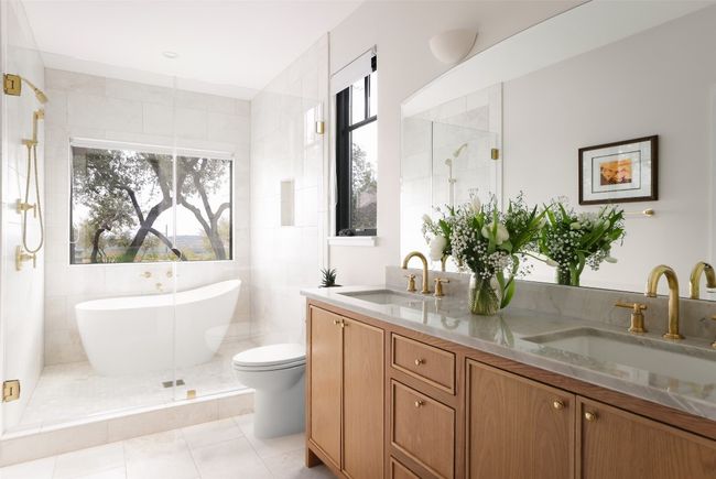 Full bath with a sink, a stall shower, plenty of natural light, quartzite counter top and marble floors | Image 21
