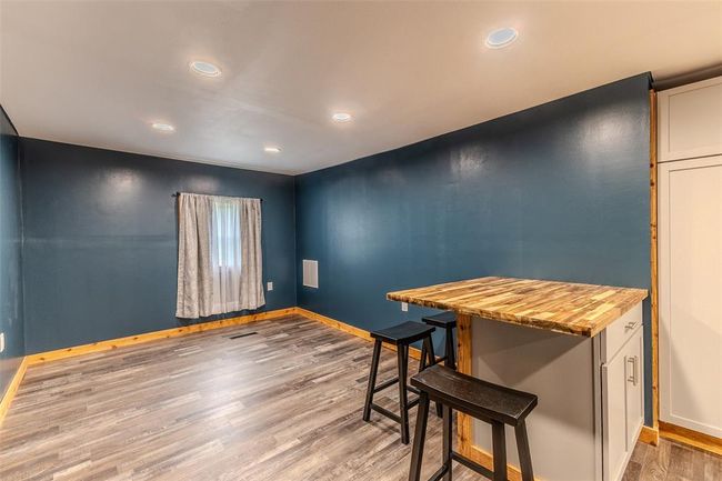 Dining room featuring baseboards, light wood finished floors, and recessed lighting | Image 15