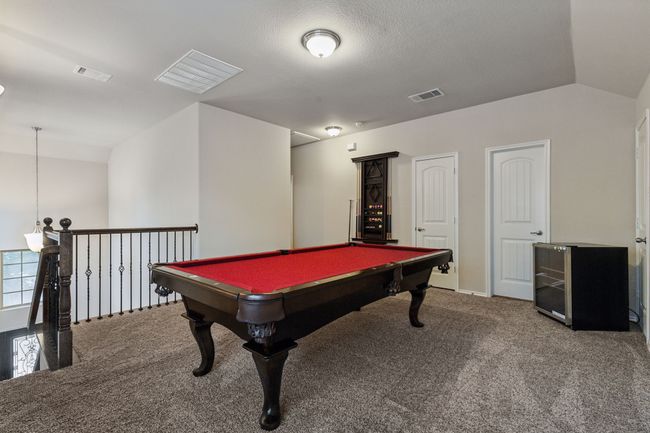 Playroom featuring carpet flooring, billiards, and baseboards | Image 20