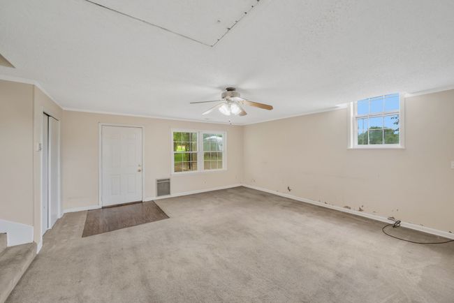 SECOND VIEW OF REC ROOM WITH ACCESS TO COVERED PATIO AND CARPORT. | Image 20