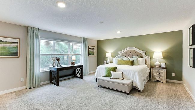 The primary bedroom in the Redwood floorplan is the largest that we offer in any of our floorplans! Plenty of space for a California King bed, PLUS a small sofa, chair etc for reading or relaxing in your primary suite! | Image 23