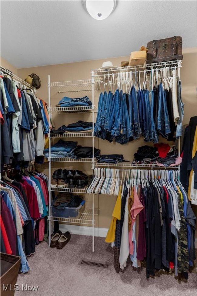 Walk in closet featuring carpet floors | Image 26