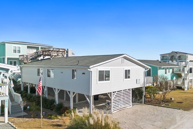 Rear view of property featuring a carport | Image 31