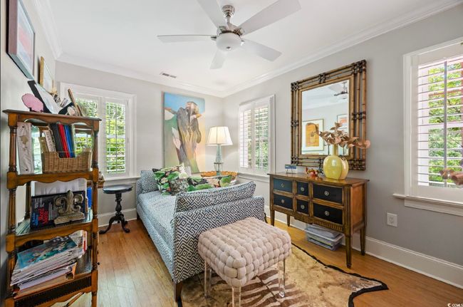 Sitting room with plenty of natural light, ceiling fan, and crown molding | Image 22