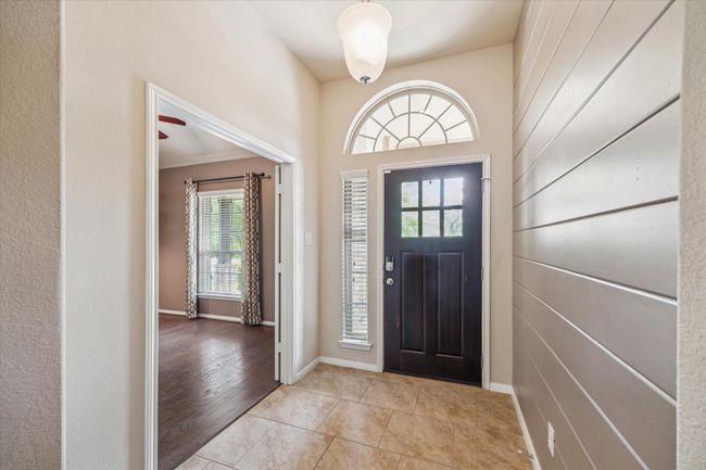Stunning entryway with elegant lighting and an inviting atmosphere. | Image 10