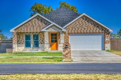 View of front of home featuring a garage | Image 1