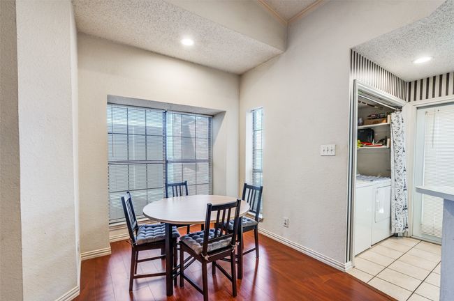 Dining area , wood finished floors, washing machine and dryer | Image 7
