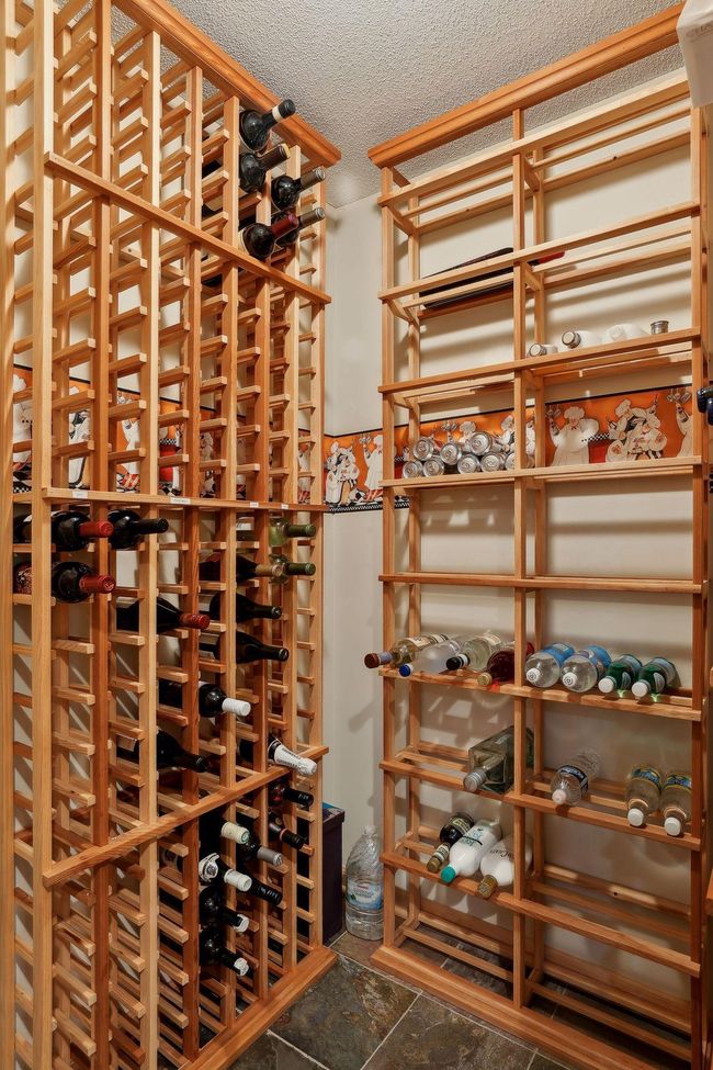 Wet bar complete with a wine cellar and built-in ice maker. | Image 24