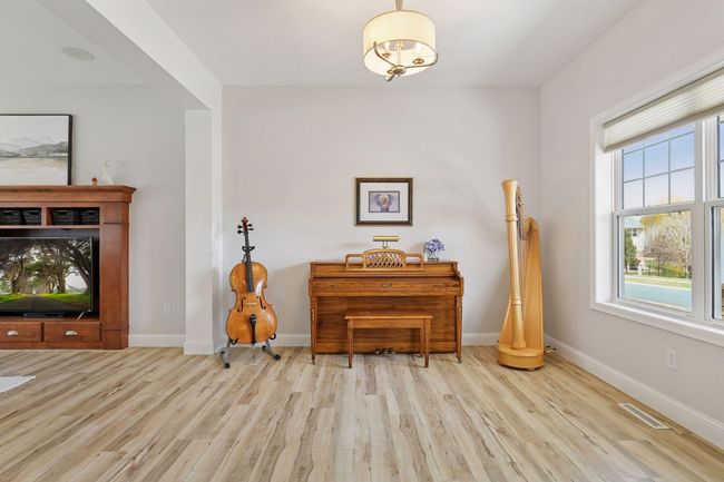 Dining room or living room space currently being used as a music room. | Image 10
