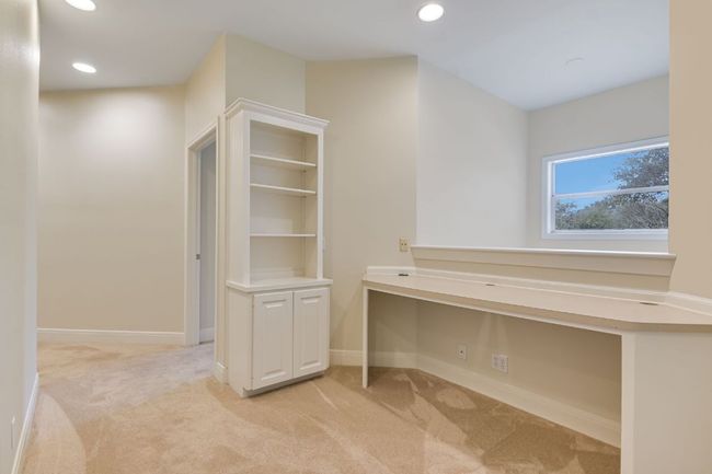 Upstairs study area with storage for games and toys. | Image 27