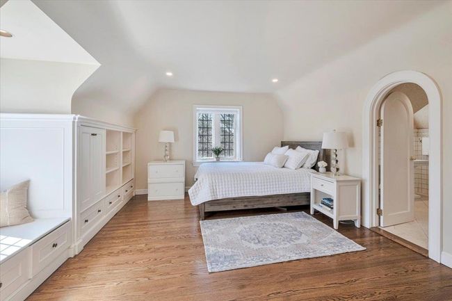 Ensuiite bedroom with recessed lighting, and lofted ceiling makes the perfect retreat for happy guests! | Image 18