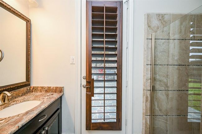 3rd Downstairs Bedroom Attached Full Bath Leading to Back Covered Patio | Image 31