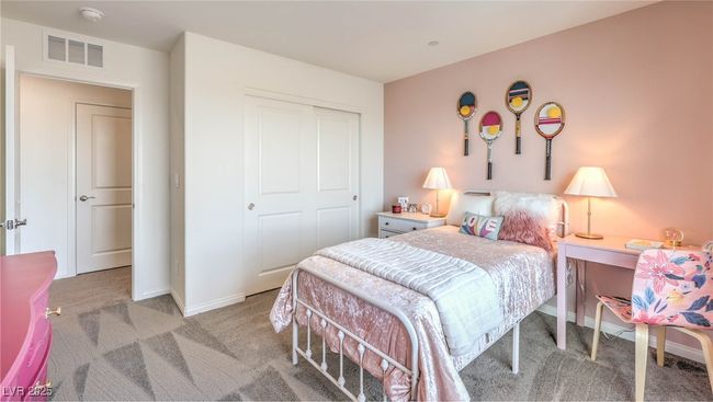 Photo is representational only; actual home finishes may vary. Bedroom with carpet flooring, baseboards, and a closet | Image 11