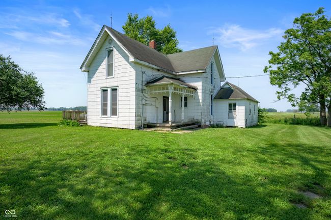 back of property with a yard and a chimney | Image 4