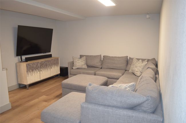 Basement living area with wood finished floors | Image 29