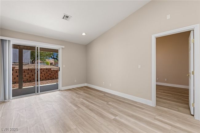 Unfurnished room with vaulted ceiling, light wood-type flooring, and recessed lighting | Image 4