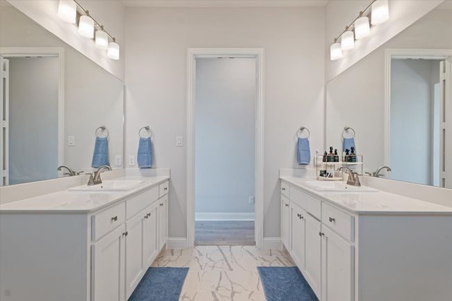 Bathroom featuring marble finish flooring and two vanities | Image 26