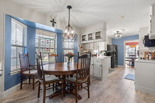 Dining room featuring a notable chandelier | Image 17
