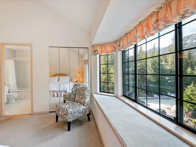 Sitting room with carpet floors and high vaulted ceiling | Image 17