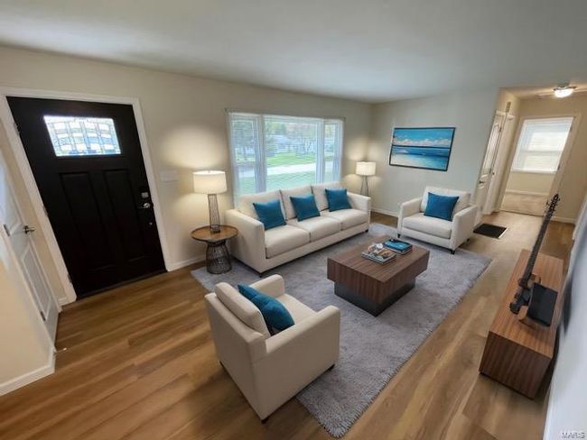 Foyer with baseboards, wood finished floors, and visible vents | Image 8