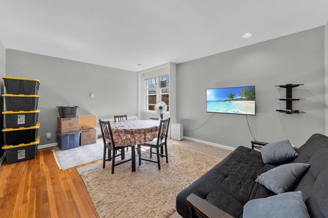 Dining space with baseboards and wood finished floors | Image 9