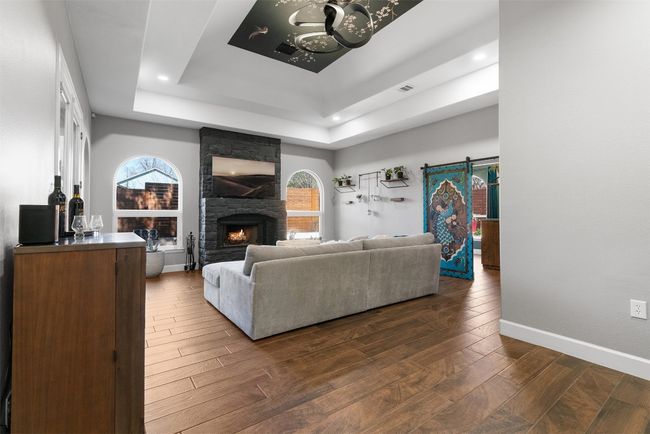 A fireplace in the living room creates a cozy and inviting atmosphere, perfect for chilly evenings or just setting the mood for a laid-back night | Image 20