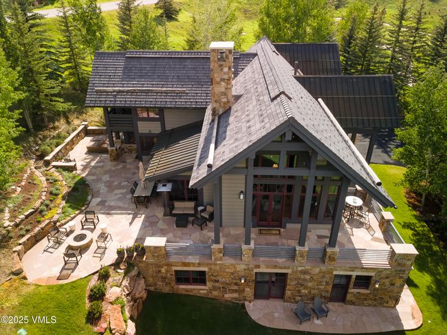 Multi-Sided Flagstone Patio with Panoramic Outdoor Space and a Built-In Gas Fire Pit. | Image 58