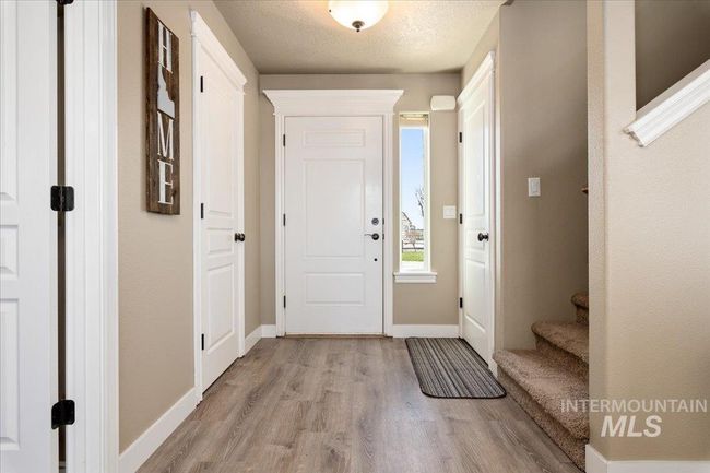 Entryway with light wood-style floors and stairway | Image 4