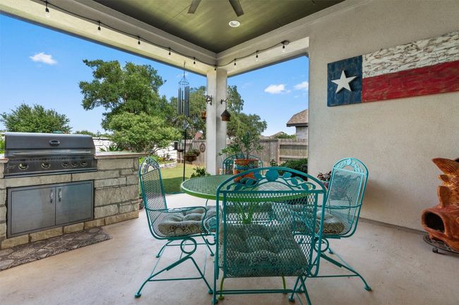 View of patio / terrace with ceiling fan and outdoor dining area | Image 27