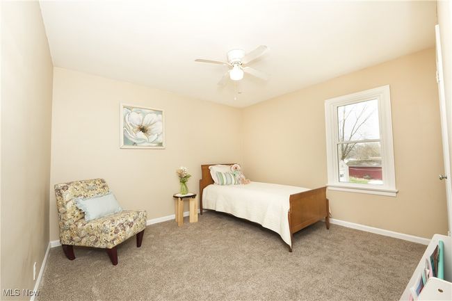 Bedroom with baseboards, carpet floors, and ceiling fan | Image 22