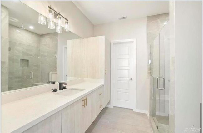 Bathroom featuring vanity and an enclosed shower | Image 8