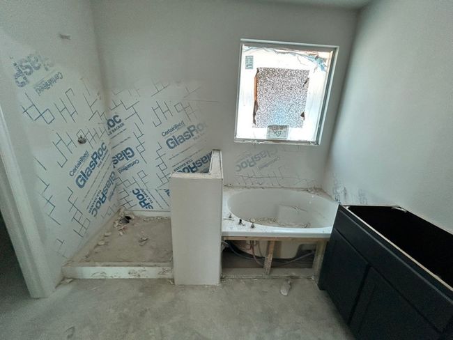Bathroom featuring a garden tub | Image 9