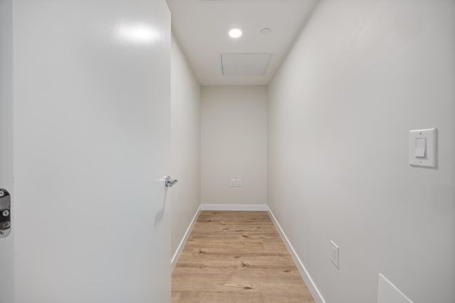 Hallway featuring baseboards and light wood-style floors | Image 16