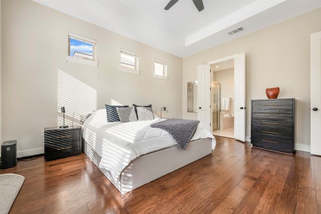 Bedroom featuring dark wood-type flooring and ceiling fan | Image 18