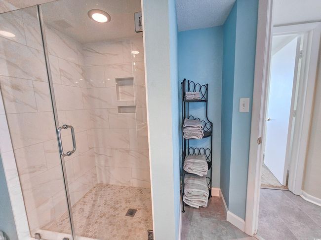 Full bath with a shower stall and baseboards | Image 33