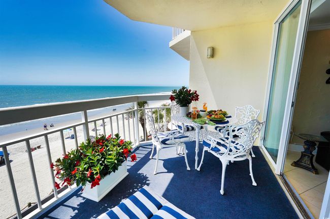 Balcony with view of water and beach | Image 32