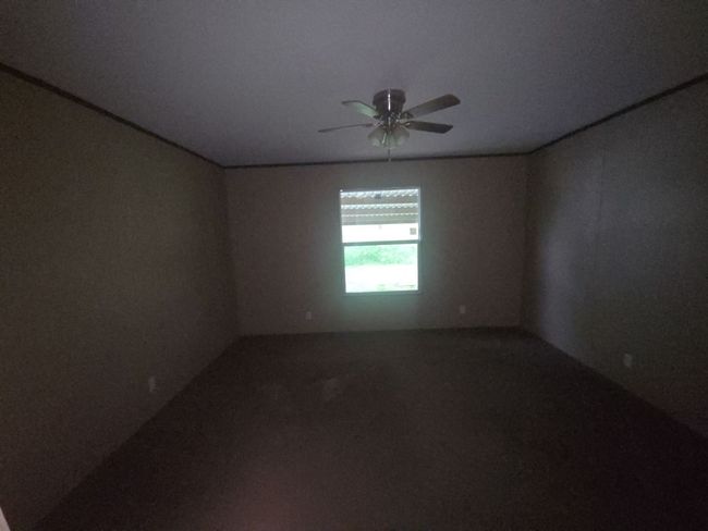 Empty room with carpet flooring and a ceiling fan | Image 20