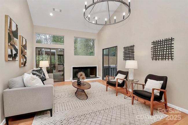 Cozy fireplace perfect for winter nights and sliders to deck. | Image 6