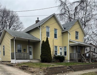 View of front facade featuring a porch | Image 1