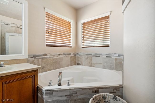 Full bathroom with vanity and a bath | Image 32