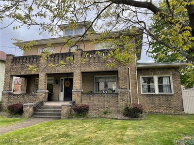 View of front of home featuring a front lawn | Image 1