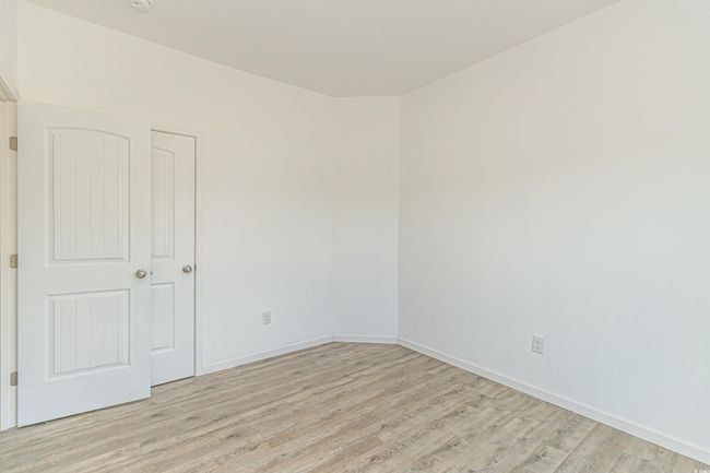 Unfurnished bedroom featuring light wood-style flooring | Image 23
