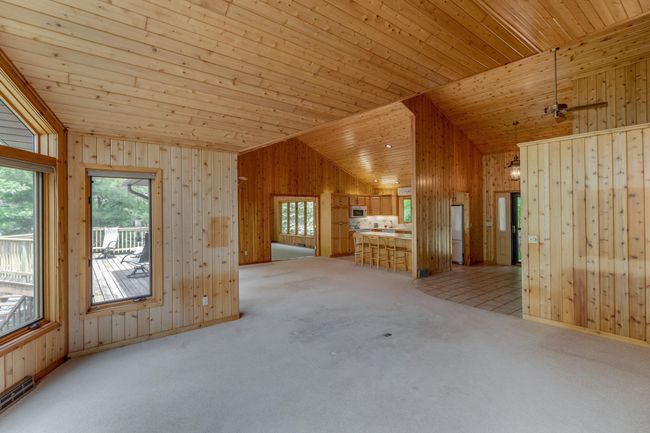 Vaulted ceilings, open floor plan and large windows provide an abundance of natural light! | Image 13